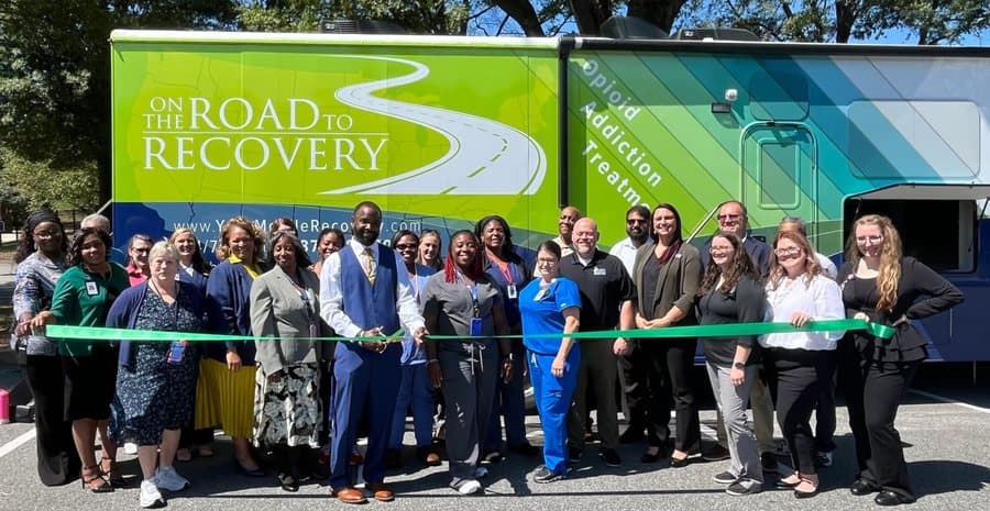 Community gathering at a behavioral health mobile clinic launch